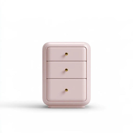Petite commode rose à trois tiroirs et bordure arrondie